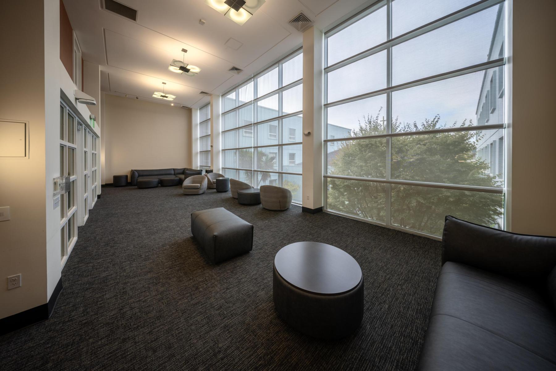 Open study space with gray and black furniture