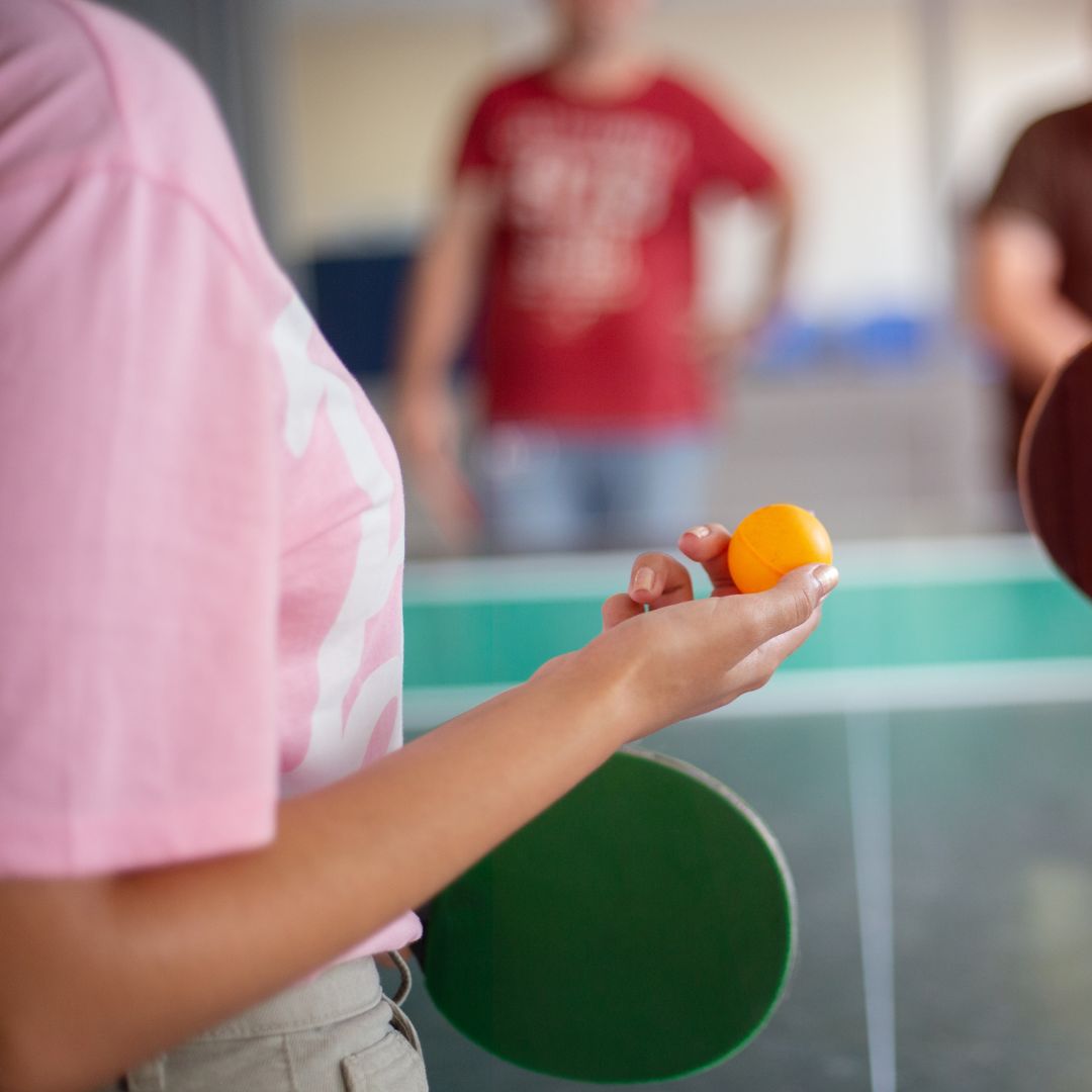 Blurred figures playing table tennis