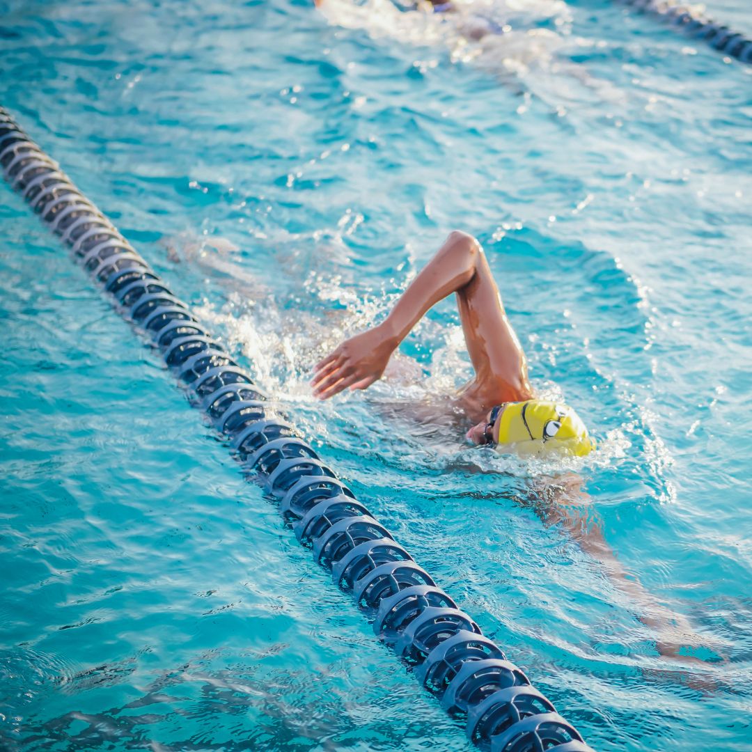 individual swimming in pool