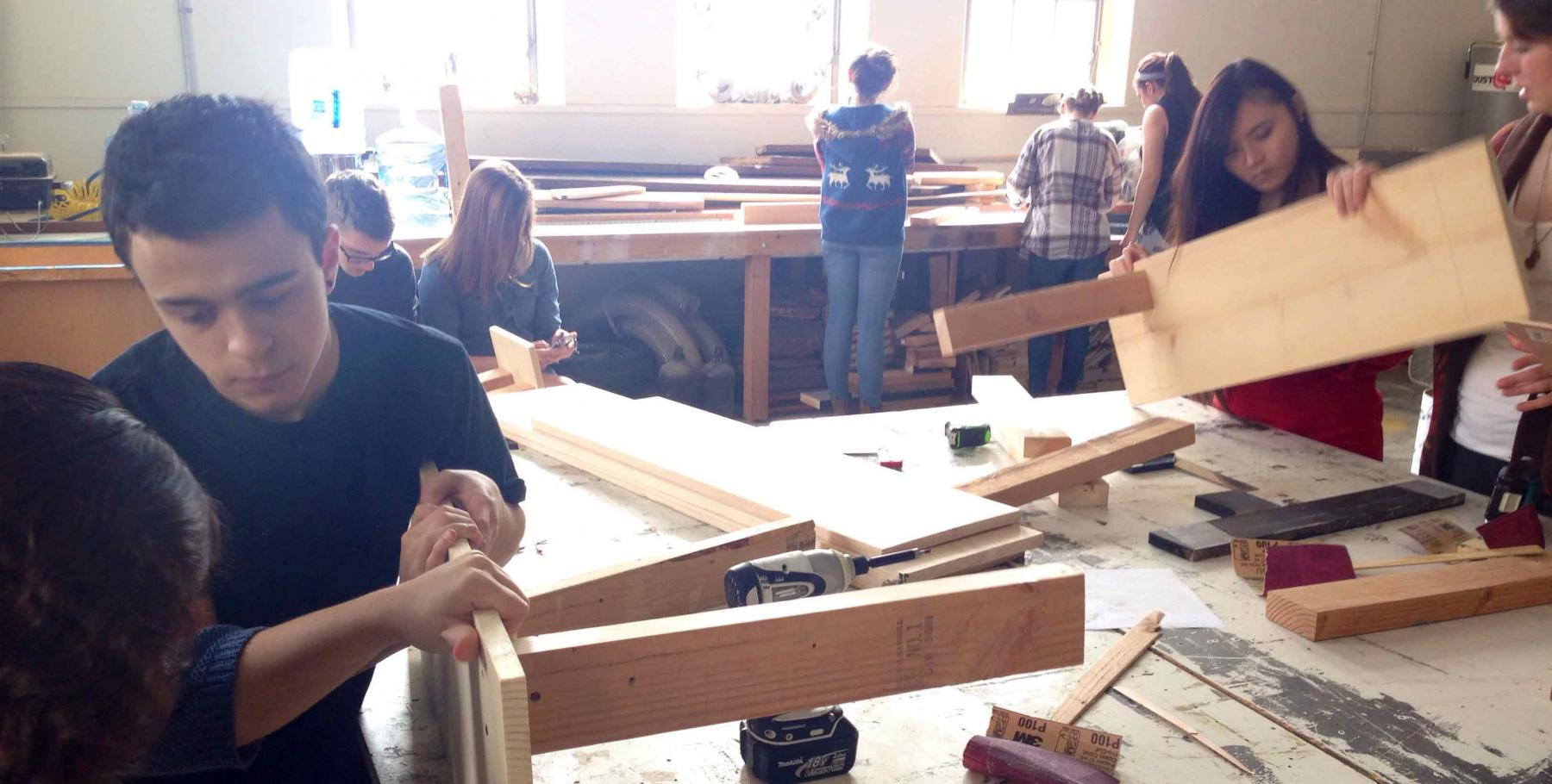 students working in the Scene shop building benches