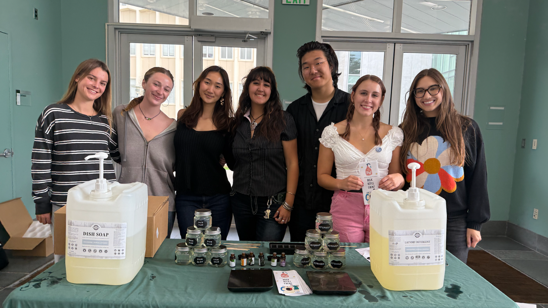 "students tabling givng laundry detergent and dish soap"