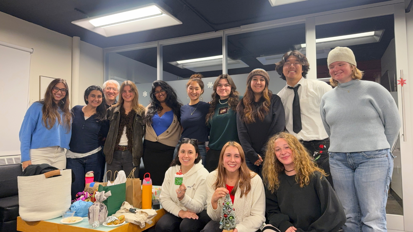 "Employees of the Office of Sustainability similing at end of year dinner"