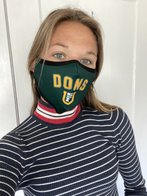 Deputy Title IX Coordinator, Trina Garry with a face mask that says DONS 