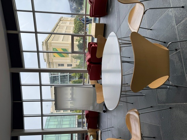 "Chairs and tables and a whiteboard"
