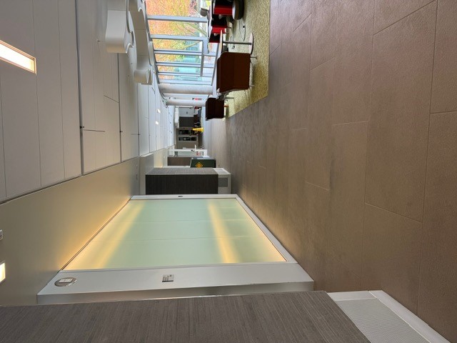 "Hallway with chairs and tables"
