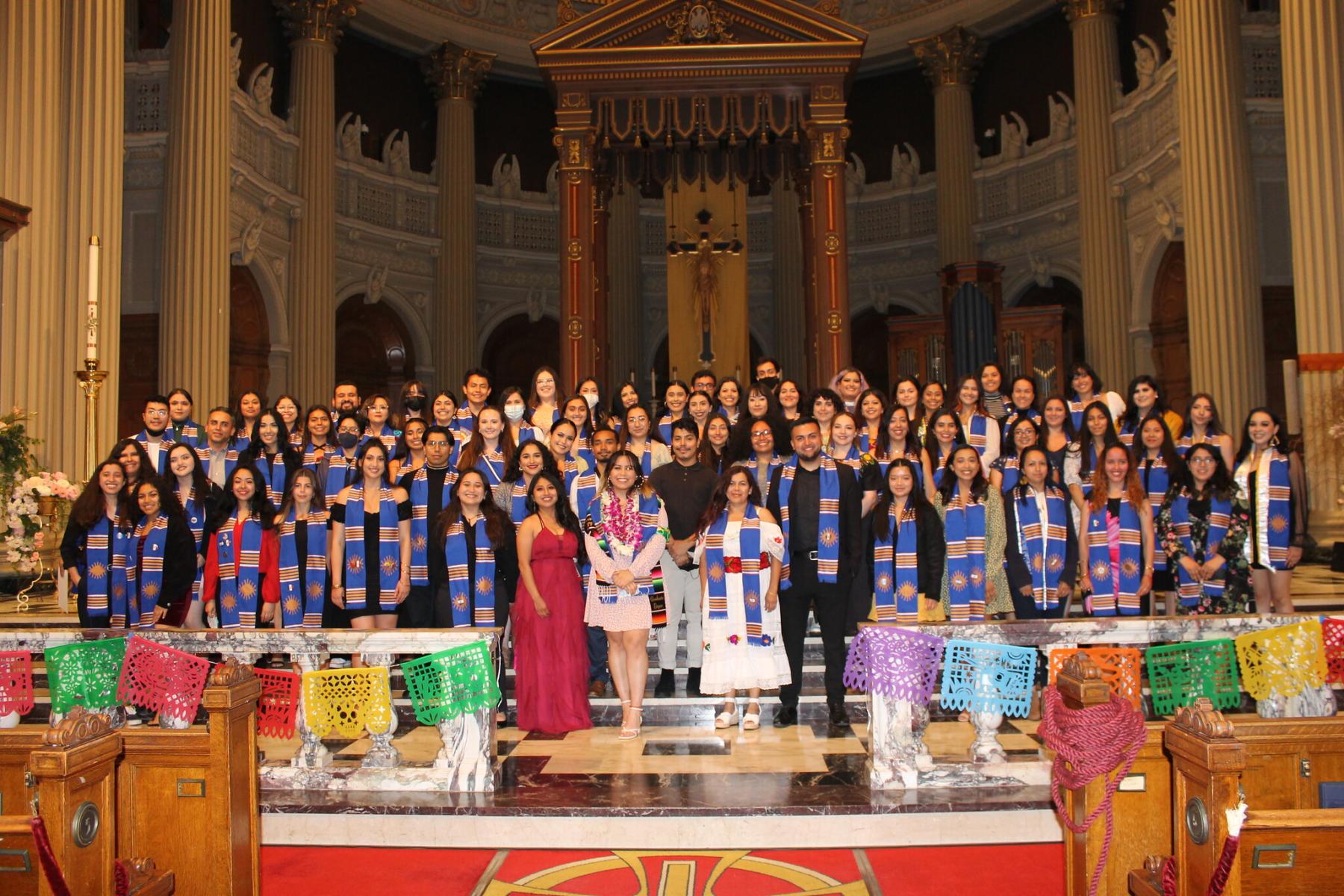 Graduating students on stage at St Ignatius Church