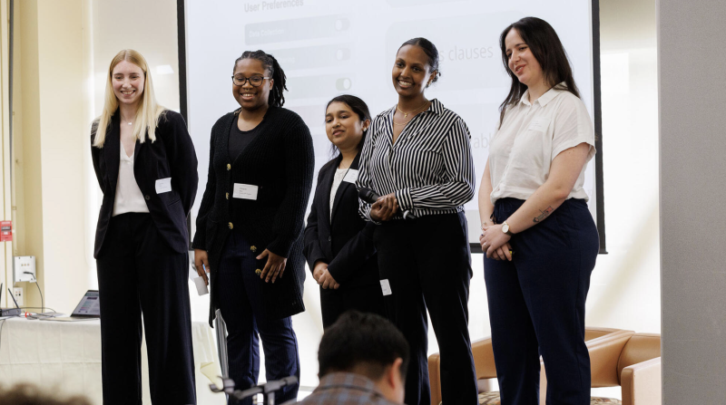 "Three people presenting"