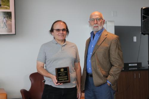 Dr. Scott Nunes, Biology, receiving Arthur Furst Award from Dr. David Furst, 2025