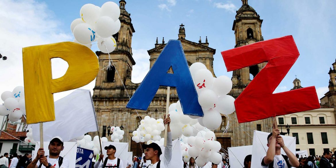 demonstration for peace in colombia, people carry letters that read "PAZ" (peace)