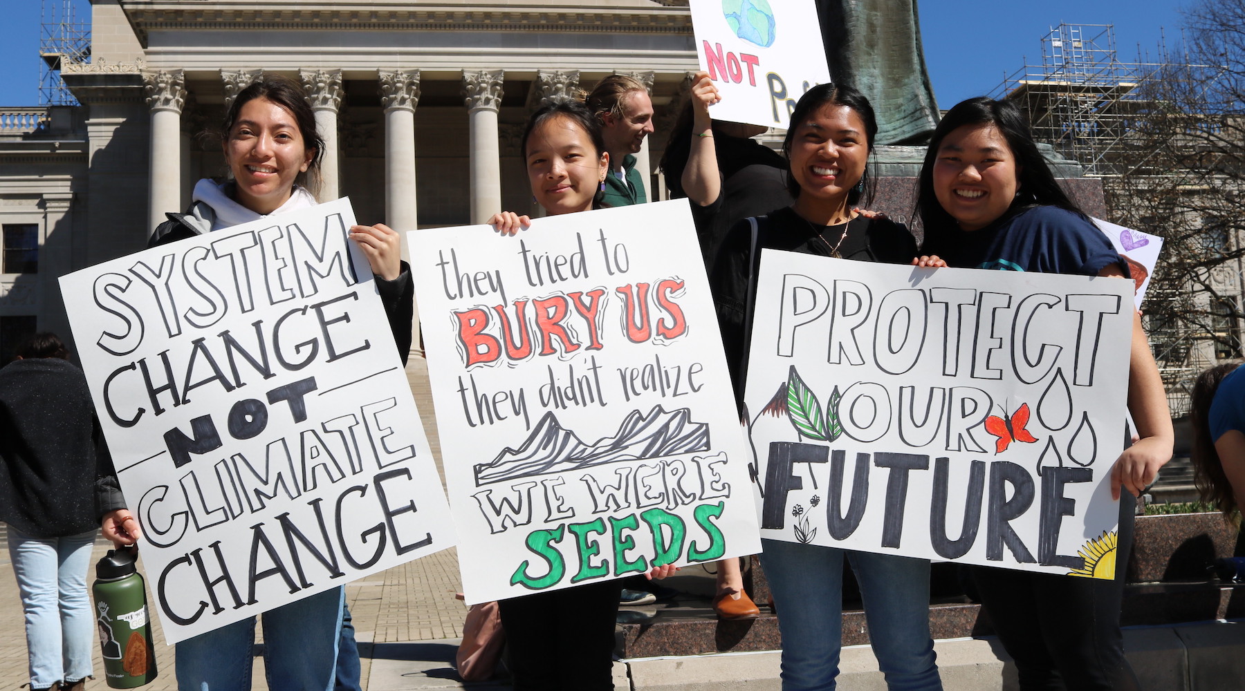 students holding environmental justice signs