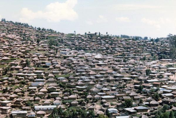 view of numerous rows of houses on hillside