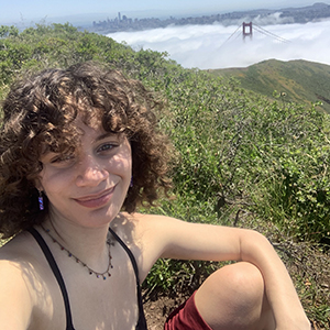 photo of Celia Celimene with the SF skyline and Golden Gate bridge in the background