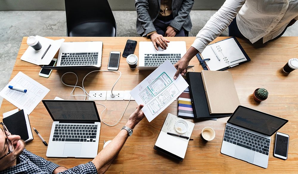 People around a table working 