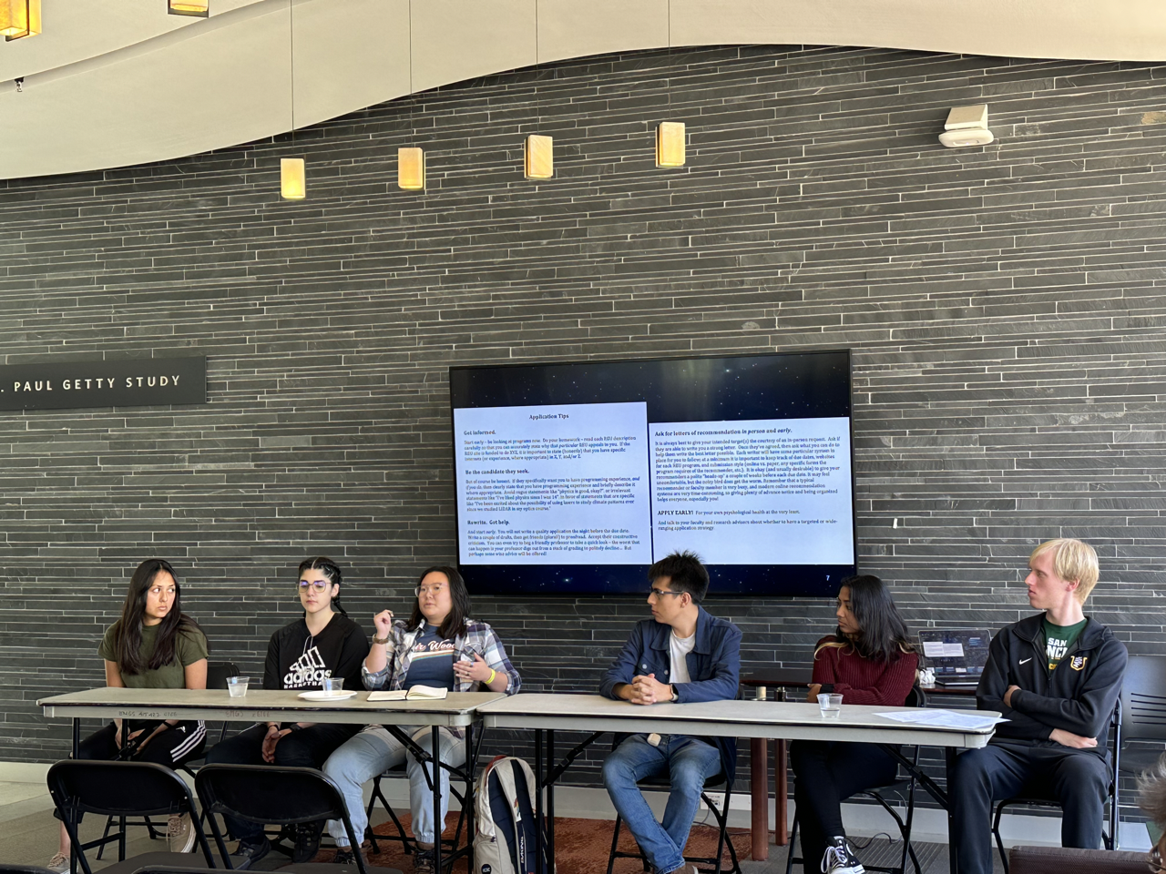 Student panelists at physics and astronomy advising session giving tips on applying to research experiences for undergraduates and other job opportunities