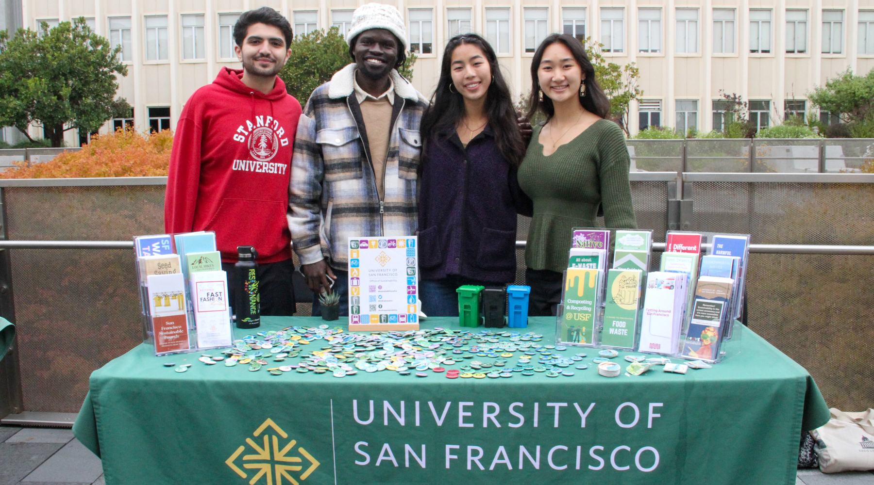 People smiling at a tabling event