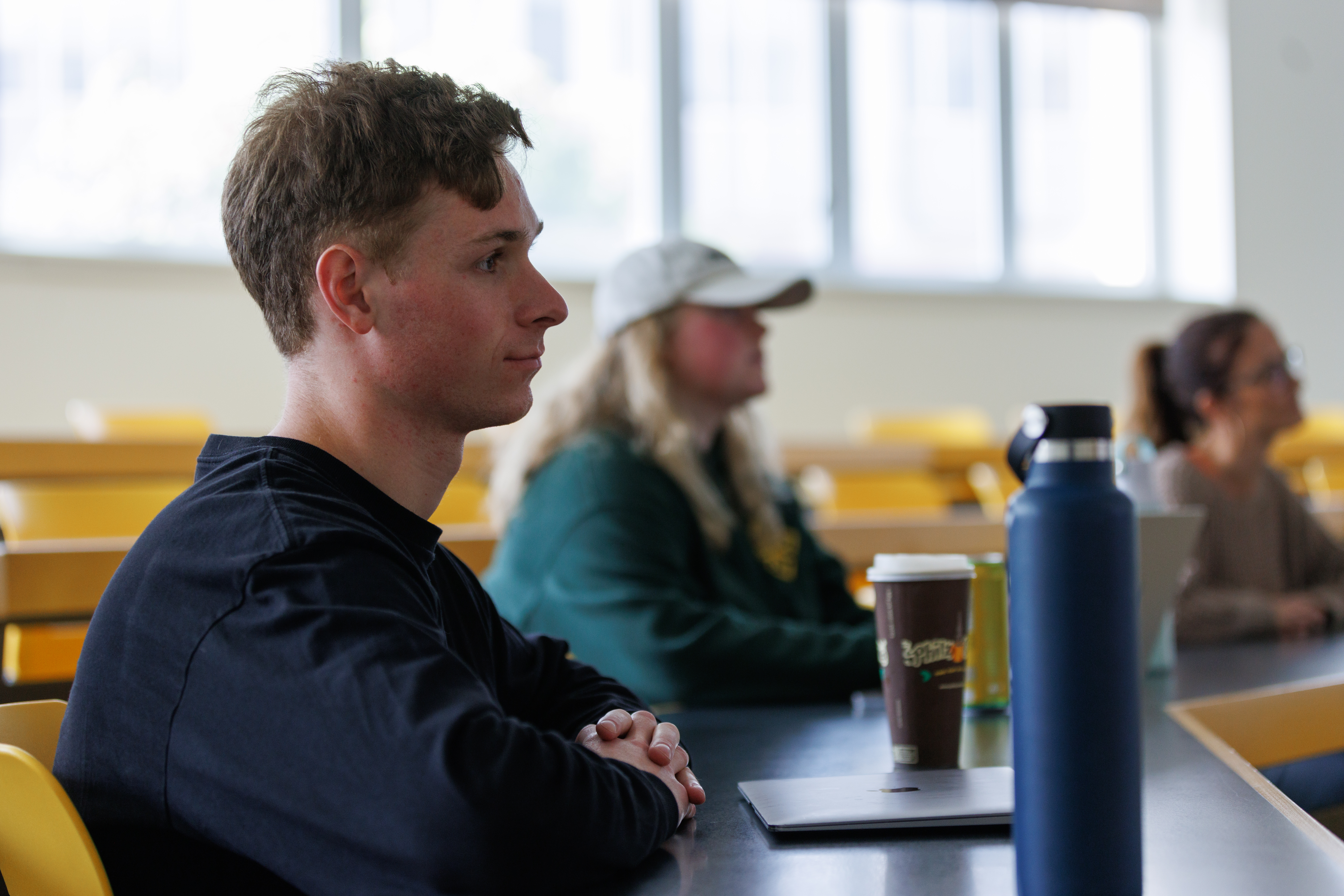 Image of a student watching a class lecture.