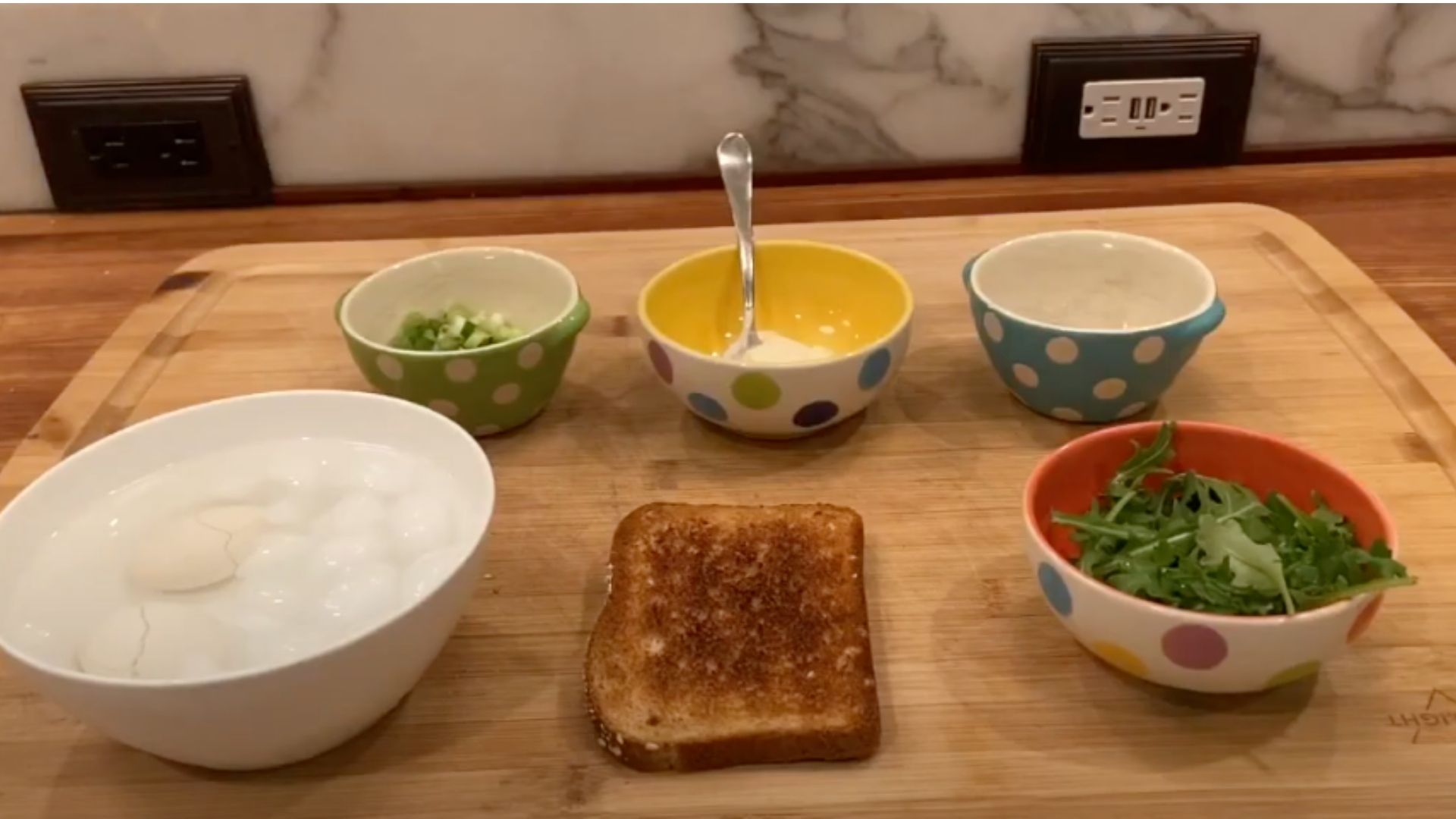 5 bowls of ingredients and toast 